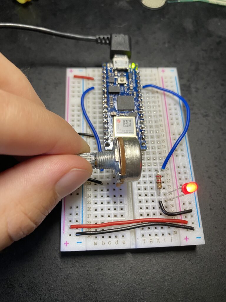 Turning potentiometer adjusts brightness of red LED