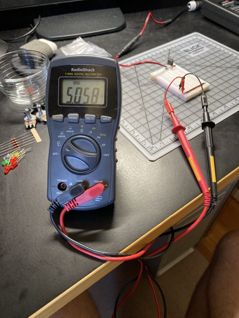 Breadboard setup with multi-meter attached