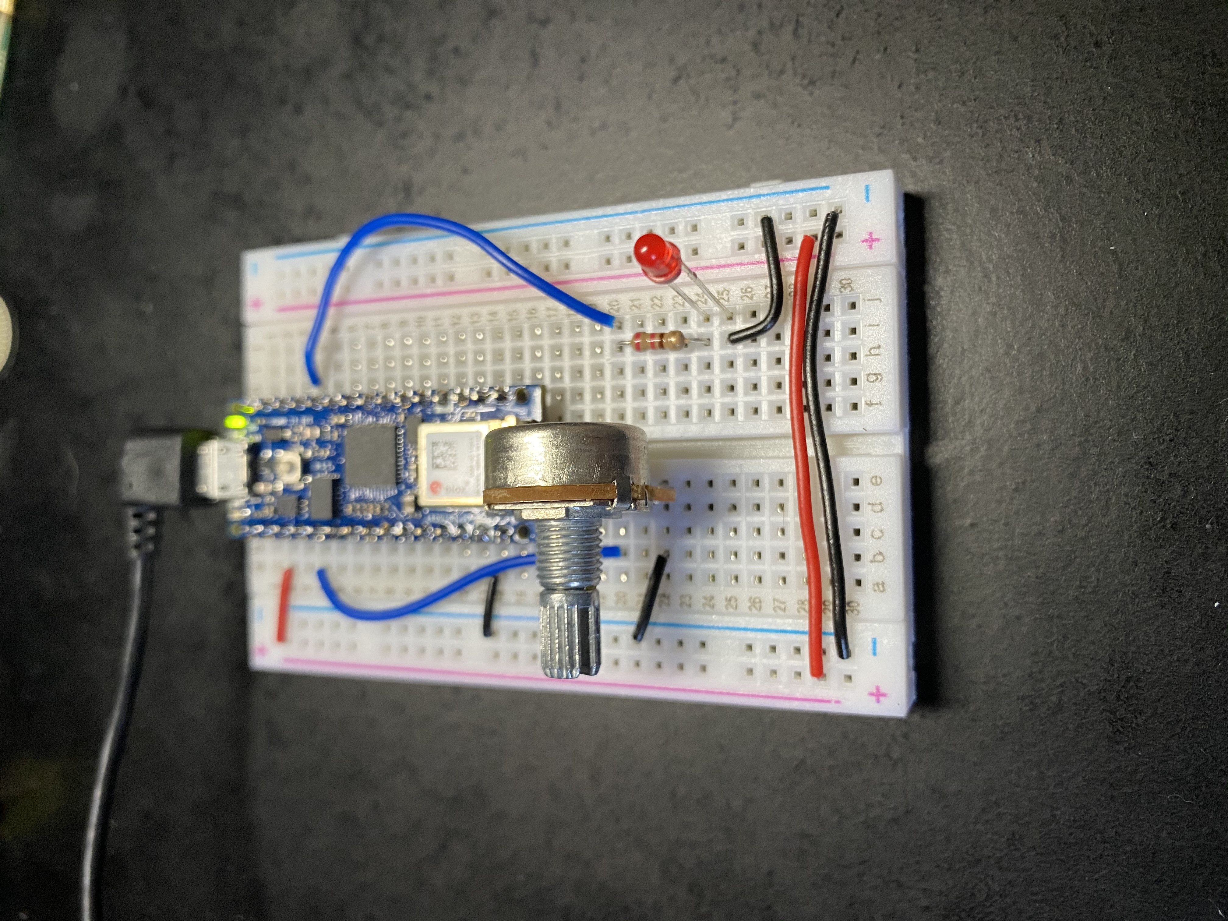 Arduino nano on breadboard with potentiometer and red LED